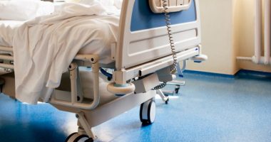 hospital bag | Angioedema News | A stock photo of the end of a hospital bed in a hospital room