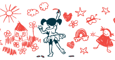 A young girls draws pictures on a wall.