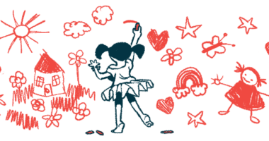 A young girls draws pictures on a wall.
