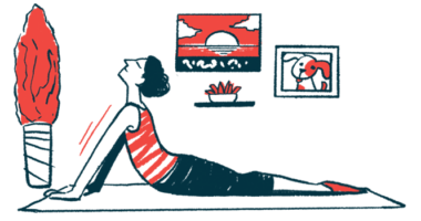 A woman practices yoga on a mat.