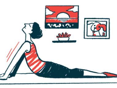 A woman practices yoga on a mat.